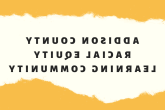 Logo of Addison County Racial Equity Learning Community. Horizontal rectangle in white, the group name in block letters in the center, and mustard-colored top and bottom borders that look like torn paper. 